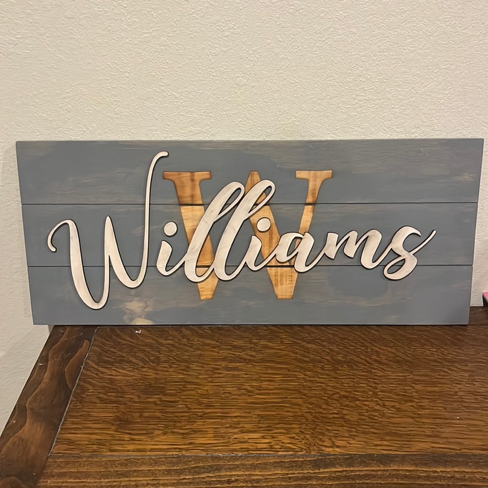 Rustic wood "Williams" sign.